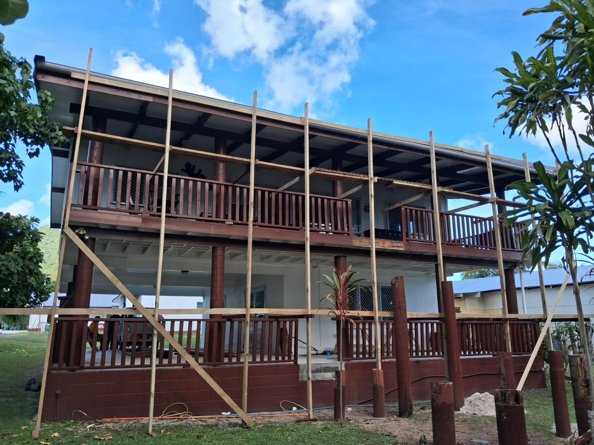 Two-storey home construction with scaffolding in Rarotonga